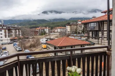 a view from a balcony of a city with a mountain at Flat in Bansko 5m walk to gondola in Bansko