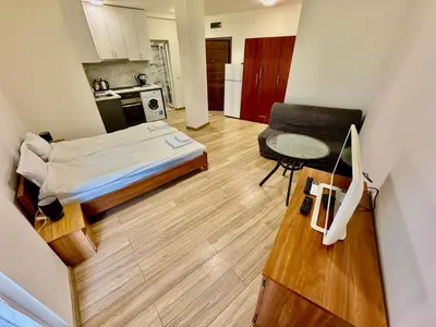 a small room with a bed and a chair in it at MK Studios Krustova Vada plus Parking!!! in Sofia