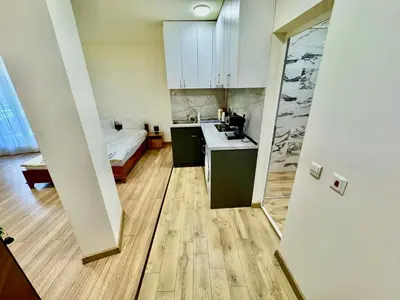 a small room with a kitchen and a bed at MK Studios Krustova Vada plus Parking!!! in Sofia