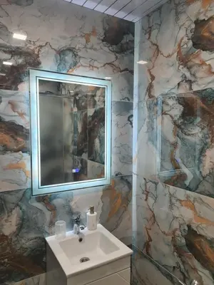 a bathroom with a sink and a mirror at Къща за гости Джерман Guest house Dzherman in Sapareva Banya