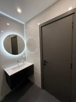 a bathroom with a sink and a mirror at DomBox Sofia Suites - Stylish 2 Bedroom in Center - Free Garage in Sofia