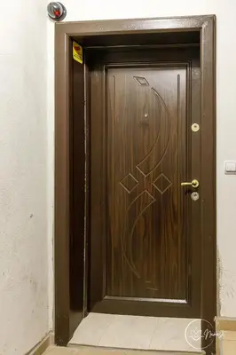 a brown door with a graffiti on it at Namaste apartment - cozy, central and relaxing stay near AUBG, freshly renovated in Blagoevgrad