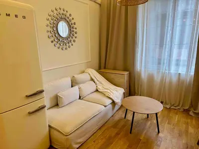a living room with a couch and a table at 2 Bedrooms Top Central Apartment on Vitosha Boulevard in Sofia
