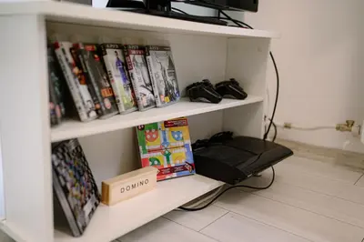 a book shelf filled with books and other books at Top Center - 2 min from NDK in Sofia