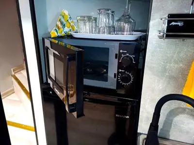 a microwave oven in a kitchen with a counter at Industrial Art Studio - Top Center - plus Free Vouchers & Gift in Sofia