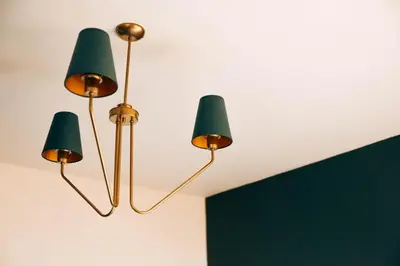 three green lights hanging from a ceiling at Wonderland Rooms for Rent in Sofia