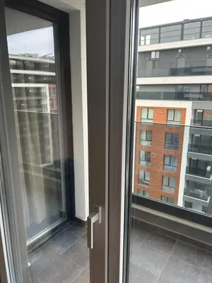 an open window with a view of a building at Cozy and comfortable panorama park Entrance E not K in Plovdiv