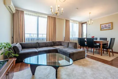 a living room with a couch and a table at Elegant Aristocratic 2 BDRM Flat, TOP Location in Sofia