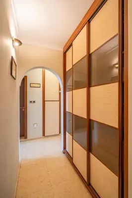 a hallway with glass doors and an archway at Elegant Aristocratic 2 BDRM Flat, TOP Location in Sofia
