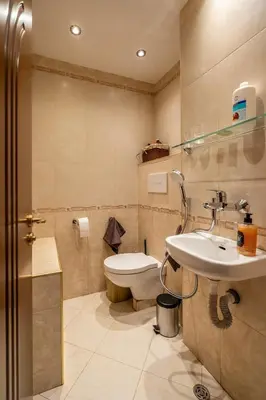 a bathroom with a toilet and a sink and a shower at Elegant Aristocratic 2 BDRM Flat, TOP Location in Sofia