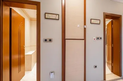 a hallway with two doors and a mirror at Elegant Aristocratic 2 BDRM Flat, TOP Location in Sofia