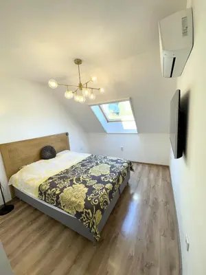 a bedroom with a bed and a skylight at Cozy Home In Central Plovdiv in Plovdiv