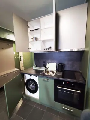 a small kitchen with a sink and a stove at RCR Einstein studios 3 in Sofia
