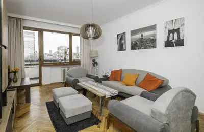 a living room with a couch and two chairs at The Cosmopolitan Shine 1-BDR Pet-Friendly Flat in Sofia
