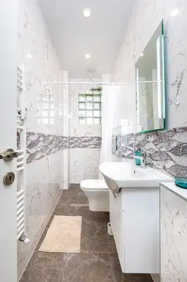a white bathroom with a sink and a toilet at Serene Living in the Heart of Plovdiv by Flat Mаnager in Plovdiv