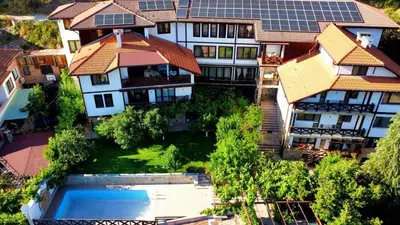 an aerial view of a house with a swimming pool at Mountain View ECOVILLA in Devin