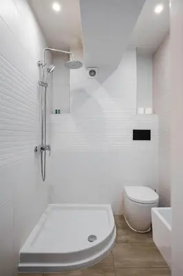 a white bathroom with a shower and a toilet at AeroLuxe Living 1BD Apartment by Flat Mаnager in Sofia