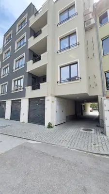 a large apartment building with two garage doors at Boho Floral Apartment near to Old Town in Plovdiv