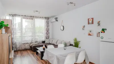 a white living room with a couch and a table at Terra Vibes - Central 1BD with balcony by Flat Mаnager in Sofia