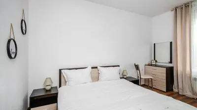 a bedroom with a large white bed and a desk at Terra Vibes - Central 1BD with balcony by Flat Mаnager in Sofia