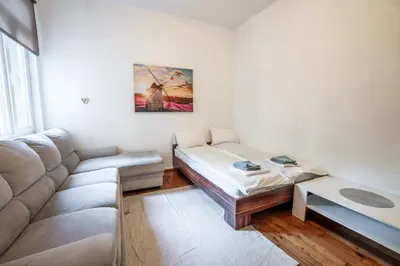 a living room with a couch and a table at Salts Market 3BR Retreat in Sofia