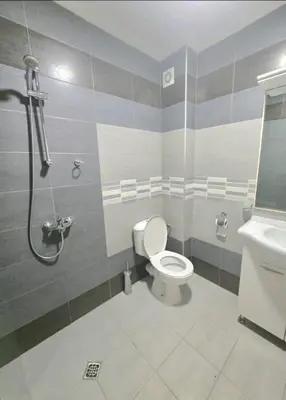 a bathroom with a toilet and a shower and a sink at Nexus of Power in Sofia