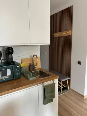 a kitchen with a sink and a microwave at Bansko Gondola Apart in Bansko