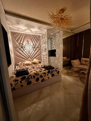 a bedroom with a bed and a chandelier at Heaven on earth in Devin