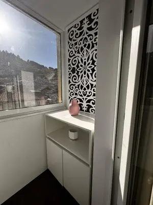 a room with a window and a vase on a dresser at Heaven on earth in Devin