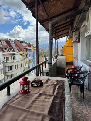 a table and chairs on a balcony with a view at Top-View Terrace 2BD Central Apt in Sofia