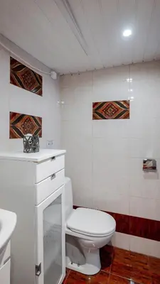 a bathroom with a white toilet and a sink at Central Cozy 1BD Compact Chic Living by Flat Mаnager in Sofia