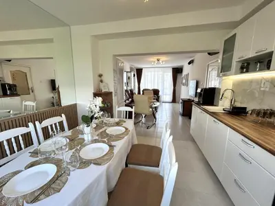 a kitchen and dining room with a table and chairs at MirrArt House - Просторен луксозен апартамент - 3 спални - 2 бани - Топ център in Plovdiv