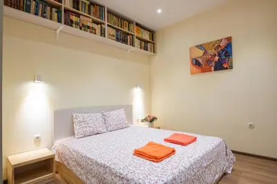 a bedroom with a bed with two towels on it at Stylish and cosy Gem, top center! in Sofia
