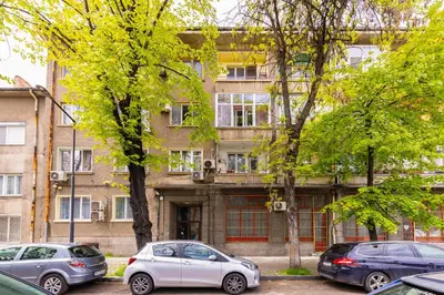 a group of cars parked in front of a building at Maritsa 1BD Apartment by Flat Manager in Plovdiv
