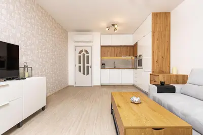 a living room with a couch and a table at Magnolia Gardens -1BD with Balcony & Parking by Flat Mаnager in Plovdiv
