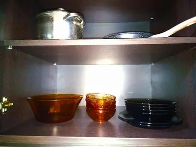 a shelf with some bowls and pans on it at Apartment Lion's bridge 1 - Top Center in Sofia