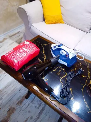 a table with a video game remote control and a gun at Apartment Lion's bridge 1 - Top Center in Sofia
