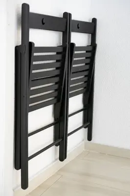 a black metal rack on the side of a wall at Студио Черно и Бяло in Sandanski