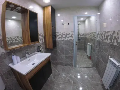 a bathroom with a sink and a shower at Guest Rooms Lencho in Anton