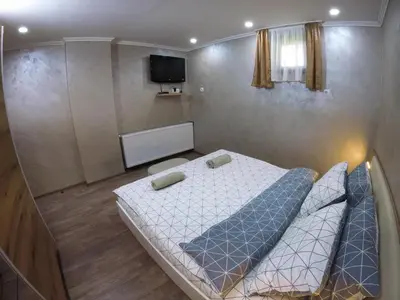 a small bedroom with a bed in a room at Guest Rooms Lencho in Anton
