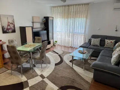 a living room with a couch and a table at United Apartments 3 in Sandanski