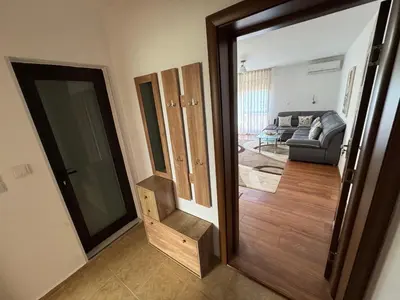 a living room with a door leading into a living room at United Apartments 3 in Sandanski