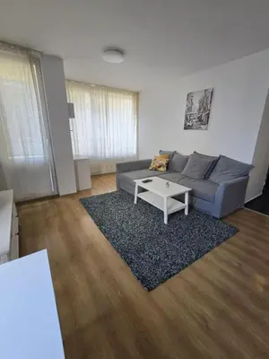 a living room with a couch and a coffee table at Paradise Locked in Sofia