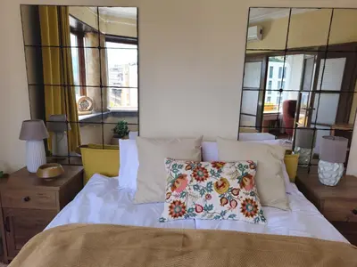 a bedroom with a bed with a pillow on it at S íRMA Apartment - Amazing View of the Golden Domes in Sofia