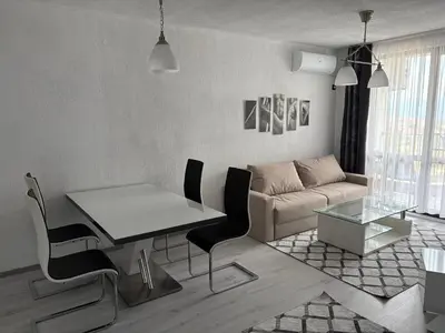 a living room with a table and a couch at Трушеви in Sandanski
