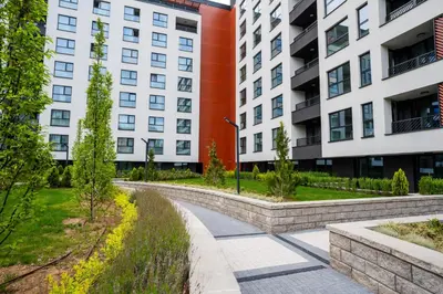 a walkway in front of two tall buildings at Stylish Apartment in City Center in Sofia