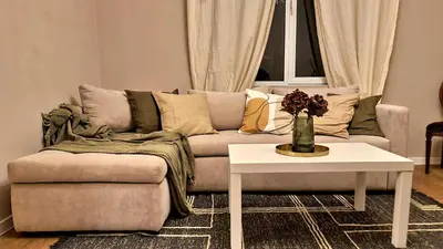 a living room with a couch and a table at Bright 2-BDRM - Stunning Views - Sofia Center in Sofia