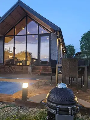a pavilion with a fire hydrant on a wooden deck at Villa Selya - Private Pool & Mountain View in Selyanin