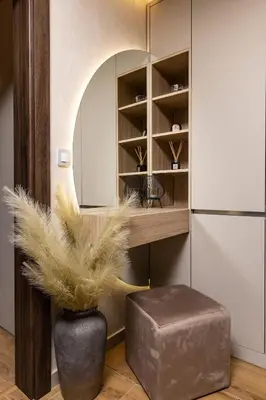 a room with a vase with a ottoman and a mirror at TOP Center apt 'Pemena' FREE Private Parking in Plovdiv