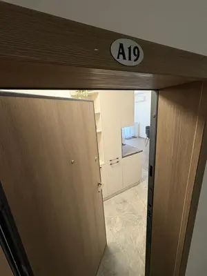 an elevator door with a sign on top of it at Nikea apart 1 in Velingrad